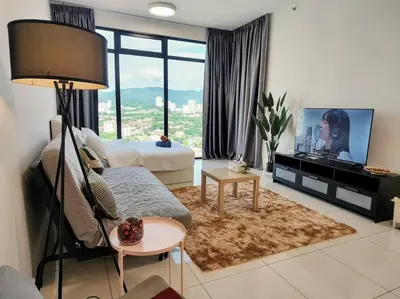 a living room with a couch and a tv at SkyPool 2Br 8pax Premium Suites Beacon Georgetown Penang in George Town