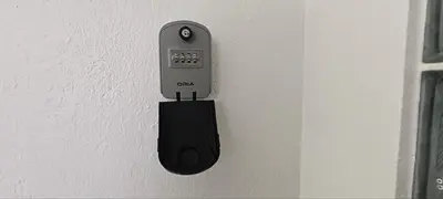 a electronic device is attached to a wall at Ipoh Garden East Homestay by Grab A Stay in Ipoh