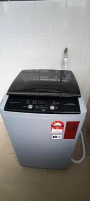 a toaster oven sitting on the floor in a room at Ipoh Garden East Homestay by Grab A Stay in Ipoh