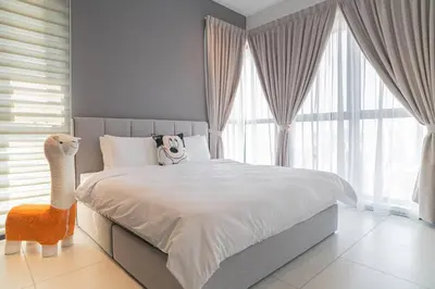 a bedroom with a bed and a large window at Mickey's Magic Urban Suites Jelutong Penang, Seaview in Jelutong