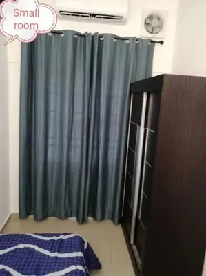 a bathroom with a large shower curtain and a cabinet at Simpang Ampat QQ in Simpang Ampat