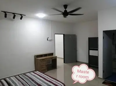 a bedroom with a bed and a ceiling fan at Simpang Ampat QQ in Simpang Ampat