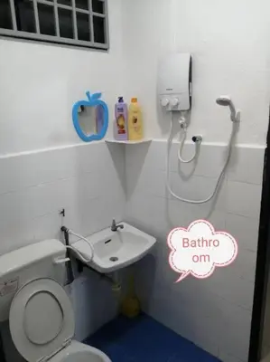 a bathroom with a toilet and a sink at Simpang Ampat QQ in Simpang Ampat
