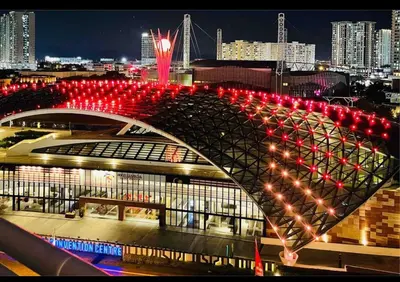 a bridge with red lights over a city at night at Arena Spice Guesthouse in Bayan Lepas