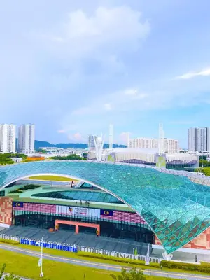 a large building with a glass roof in a city at Arena Spice Guesthouse in Bayan Lepas