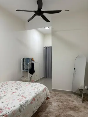 a bedroom with a bed and a ceiling fan at AFA Home KKB in Kuala Kubu Baharu