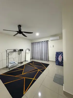 a room with a ceiling fan and a black and yellow carpet at AFA Home KKB in Kuala Kubu Baharu