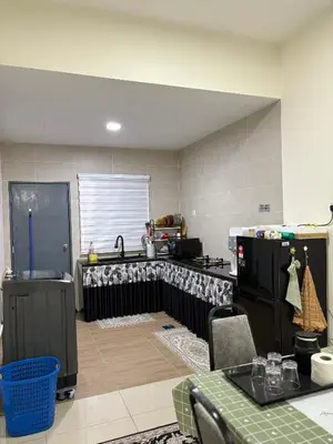 a kitchen with a stove and a refrigerator at AFA Home KKB in Kuala Kubu Baharu