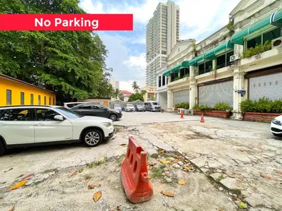 a street with cars parked in a parking lot at Lili Stay by the beach in George Town