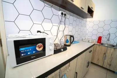 a microwave on a counter in a kitchen at Seaview mansion one Georgetown Penang in George Town
