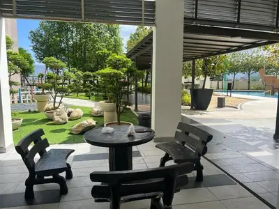 a patio with a table and two chairs and a table at D Festivo Residences Ipoh in Ipoh