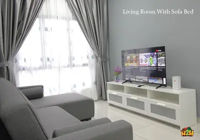 a living room with a tv and a couch at H2H - Horizon18 @ Ipoh Town Center in Ipoh