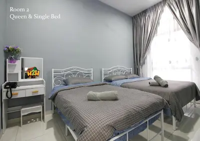 a bedroom with two beds and a window at H2H - Horizon18 @ Ipoh Town Center in Ipoh