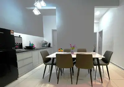 a dining room with a table and chairs in a kitchen at H2H - Horizon18 @ Ipoh Town Center in Ipoh