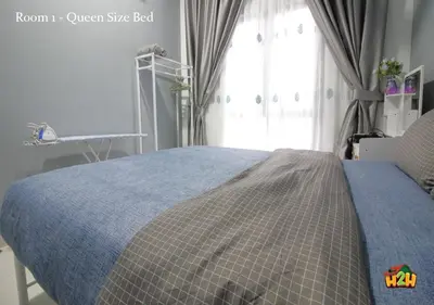 a bedroom with a blue bed with a window at H2H - Horizon18 @ Ipoh Town Center in Ipoh