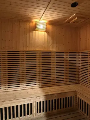 a room with a wooden wall with wooden shutters at Lost World Tambun 1BR 3/4Pax @Sunway Onsen Suite in Kampong Batu Lapan