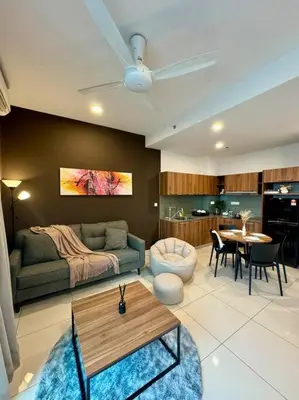 a living room with a couch and a table at Lost World Tambun 1BR 3/4Pax @Sunway Onsen Suite in Kampong Batu Lapan