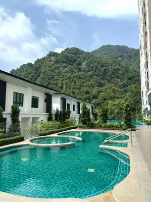 a large swimming pool in front of a building at Lost World Tambun 1BR 3/4Pax @Sunway Onsen Suite in Kampong Batu Lapan