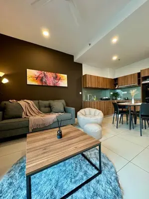 a living room with a couch and a table at Lost World Tambun 1BR 3/4Pax @Sunway Onsen Suite in Kampong Batu Lapan