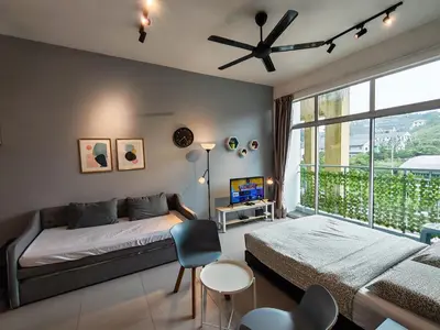 a bedroom with a bed and a large window at 1BR Cool Homestay at Cameron Golden Hills Night Market in Brinchang