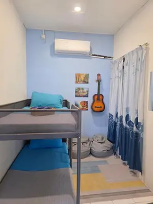 a small room with a bunk bed with a guitar at CASA AINA at Gopeng Cozy & Comfy Home in Kampong Kepayang