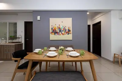 a wooden table in a living room with a table at Dream - Summer @Majestic Condo in Ipoh