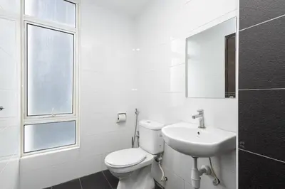a white bathroom with a toilet and a sink at Dream - Summer @Majestic Condo in Ipoh