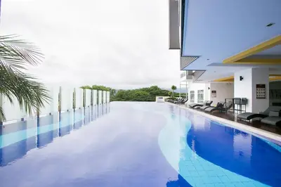 a large swimming pool in a building with at Dream - Summer @Majestic Condo in Ipoh