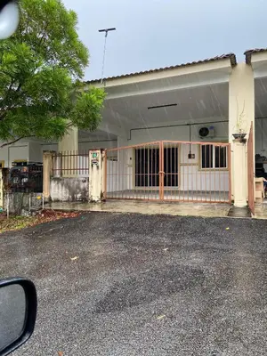 a building with a gate in front of it at EmyNuar Homestay in Batu Kurau