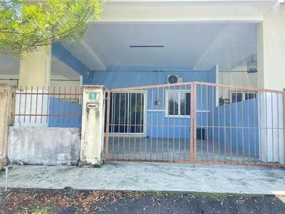 a blue gate in front of a house at EmyNuar Homestay in Batu Kurau