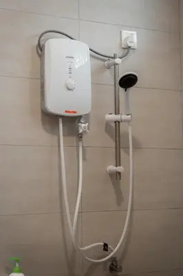 a white shower in a bathroom with aperature at BrandNew Premium House 4Room12Pax@ALMA NEAR JUSCO in Bukit Mertajam