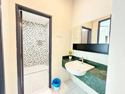 a bathroom with a sink and a shower at NAUTILUS HOME AT KARPAL SINGH For 14 PAX in George Town