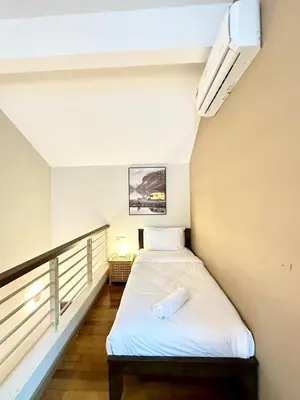 a small bedroom with a bed in a room at NAUTILUS HOME AT KARPAL SINGH For 14 PAX in George Town