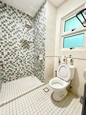 a bathroom with a toilet and a shower at NAUTILUS HOME AT KARPAL SINGH For 14 PAX in George Town