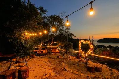 a group of lights in the dirt at night at Woodcookies Guesthouse in Pangkor