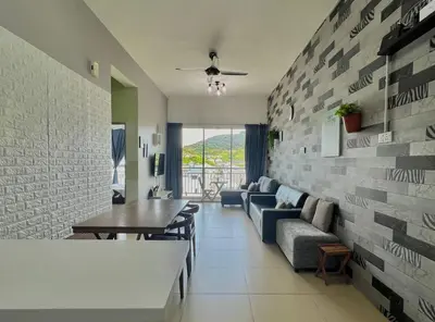 a living room with a couch and a table at Peace Homestay in Cameron Highlands