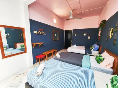 a bedroom with two beds and a mirror at Ipoh Station 18, 4 Bedroom Rainforest LOFT 1 Depan AEON Homestay in Ipoh