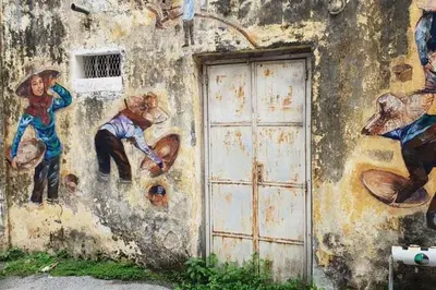 a mural on the side of a building with a door at Ipoh Station 18, Aeon Ipoh Rainforest 2 rooms LOFT 2 Homestay in Ipoh