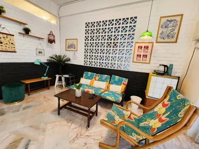 a living room with two chairs and a table at Ipoh Station 18, Aeon Ipoh Rainforest 2 rooms LOFT 2 Homestay in Ipoh