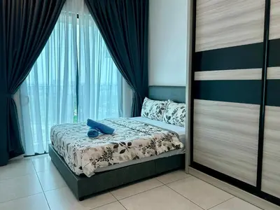 a bedroom with a bed and a large window at Suite BigStudio @Meritus Residensi in Perai
