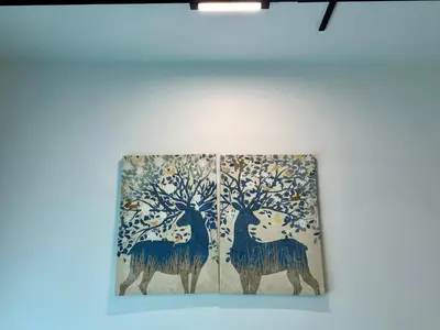 a painting of two deer in a tree on a wall at Suite BigStudio @Meritus Residensi in Perai