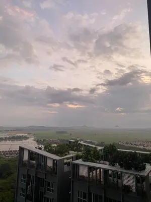 a view of a building with a cloudy sky at Newly Furnished Metropol Service Apartment with Attractive View in Bukit Mertajam