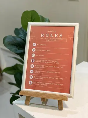 a sign for a roubles restaurant on a table at Newly Furnished Metropol Service Apartment with Attractive View in Bukit Mertajam
