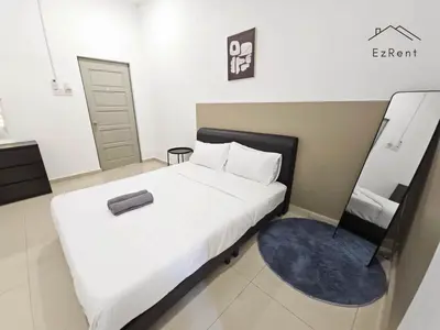 a bedroom with a large white bed and a mirror at Spacious Family 4BR House near Lake Garden Zoo Taiping with Free WiFi and Netflix in Taiping