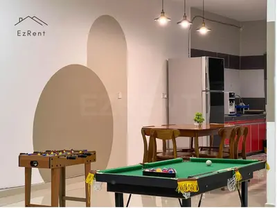 a dining room with a pool table and a kitchen at Spacious Family 4BR House near Lake Garden Zoo Taiping with Free WiFi and Netflix in Taiping
