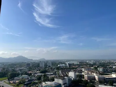 a view of a city with mountains in the background at Yuru House - The Horizon Ipoh in Ipoh
