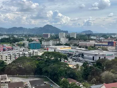 a city with buildings and mountains in the background at Yuru House - The Horizon Ipoh in Ipoh