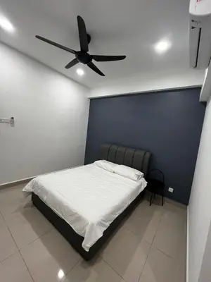 a bedroom with a bed with a ceiling fan at Stay in Passionate in Sitiawan