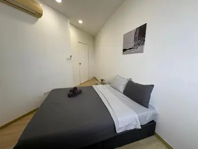 a bedroom with a large bed in a room at 2BR, 1 Car Park, 4Pax Seaview 118IslandPlaza in Tanjong Tokong