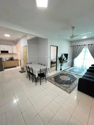 a large living room with a table and chairs at Azzalea's Apartment Ground Floor Cameron Highlands in Tanah Rata